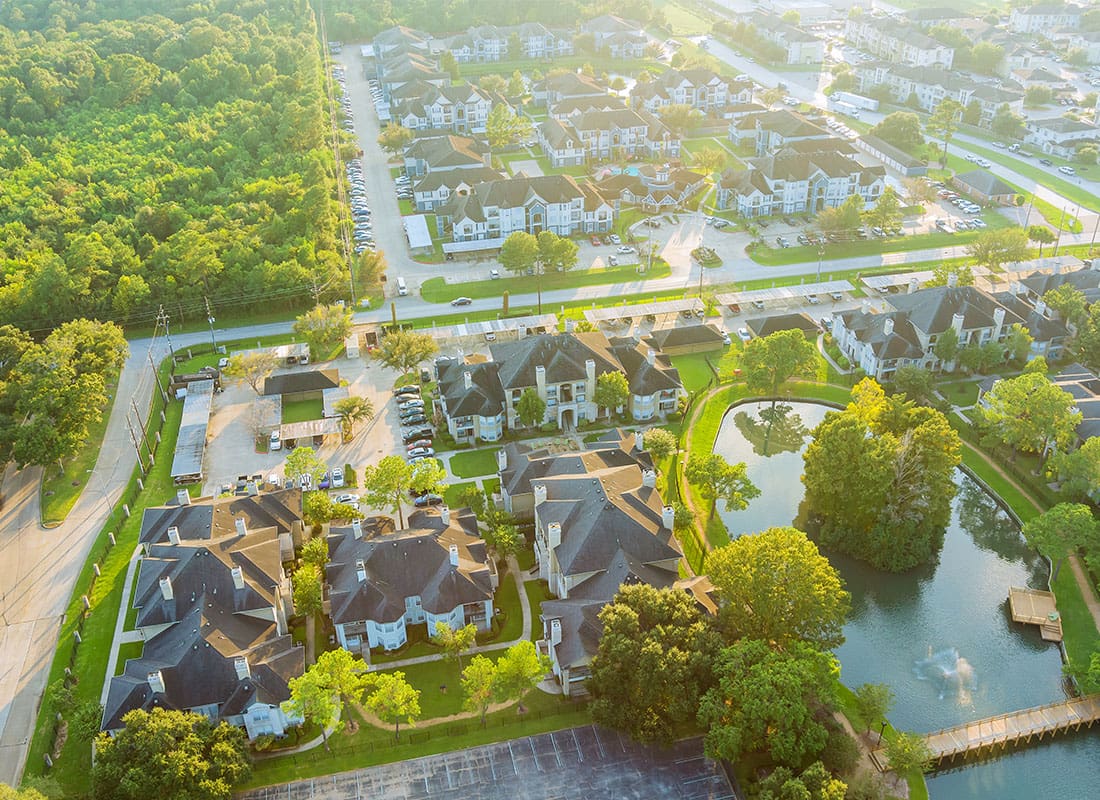 Houston, TX - Above Houston , Texas Suburb Area West of Downtown With Morning Golden Hour Sunlight